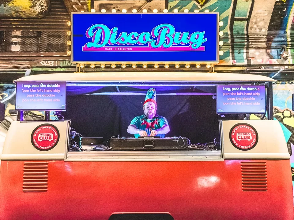 Dj dressed as elf DJing from DJ Van at an event